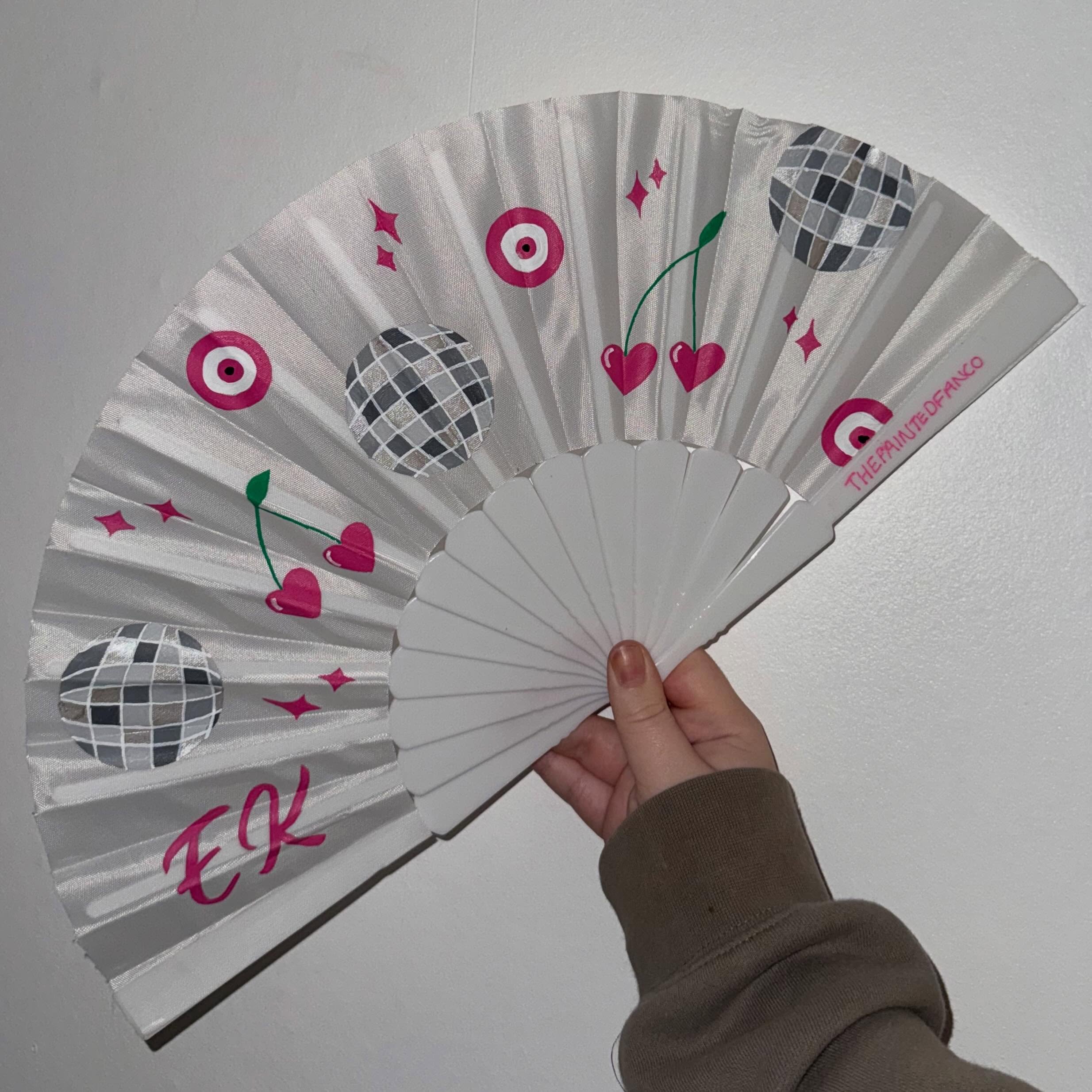 Hand-painted fan with pink script and colourful motifs